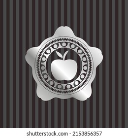 apple icon inside silver badge or emblem. 