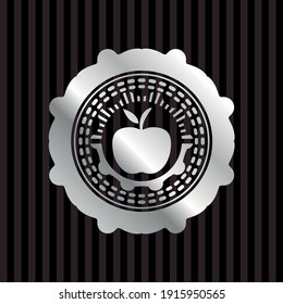 apple icon inside silver emblem. 