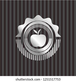 apple icon inside silvery emblem or badge