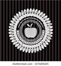 apple icon inside silvery emblem or badge