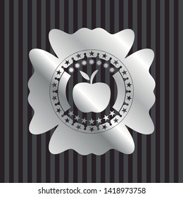apple icon inside silvery emblem or badge