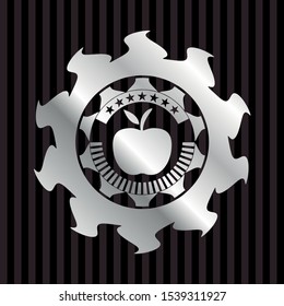 apple icon inside silvery emblem