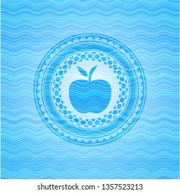 apple icon inside water representation badge background.