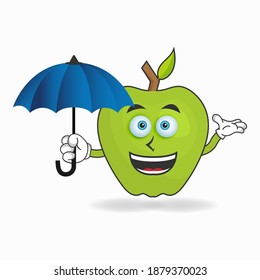 Apple mascot character holding an umbrella. vector illustration