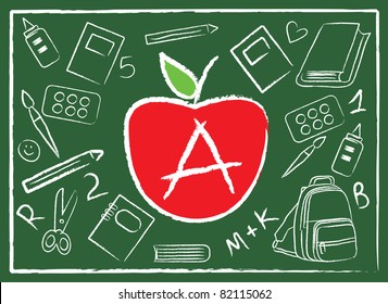 apple in the middle of school colorful accessories on green