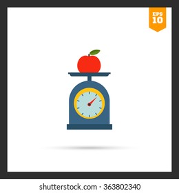 Apple on scales cup