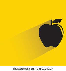 apple with shadow on yellow background