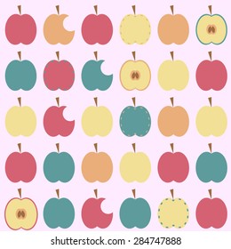Apples of different color , whole, half and bitten on a pale pink background
