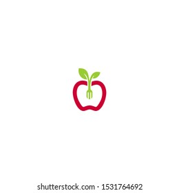 Apples with a fork poked inside with the tip of a leaf fork.