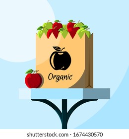 Apples in grocery paper bag with logo. Brown carton shopping bag with shop logo and fruits on a table. Flat vector illustration. Groceries on a table. Online food delivery