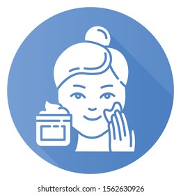 Applying cream blue flat design long shadow glyph icon. Skin care procedure. Facial beauty treatment. Face product for lifting and exfoliating effect. Makeup. Vector silhouette illustration