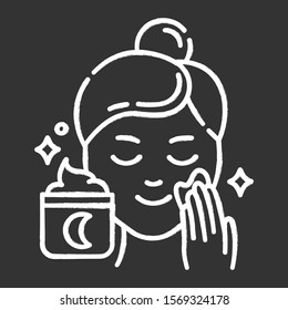 Applying night cream chalk icon. Skin care procedure. Facial treatment product. Sleeping cream for evening beauty routine. Dermatology, cosmetics, makeup. Isolated vector chalkboard illustration