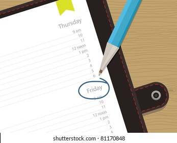 appointment book with clipping mask and pen on wood background