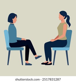 at an appointment with a psychologist. Two women sitting in chairs, one of them is wearing a blue shirt