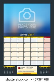 April 2017. Wall Calendar for 2017 Year. Vector Design Print Template with Place for Photo. Dark Background. Week Starts Monday. 3 Months on Page. Planner Template. Stationery Design