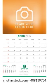 April 2017. Wall Monthly Calendar for 2017 Year. Vector Design Print Template with Place for Photo. Week Starts Sunday. 3 Months on Page