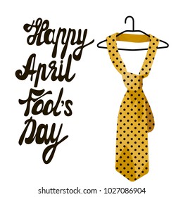 April fool s day. Vector illustration of handwritten text. Hanger with a yellow tie with polka dots . Great holiday gift cards. Stock vector.