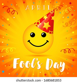 April fools day card happy smile face in party hat over colorful confetti background. Holiday design with emoji on yellow beams. Vector illustration