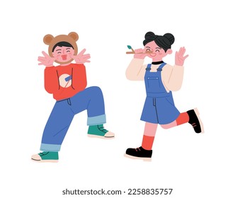 April Fool's Day. A girl wearing a Pinocchio nose, a boy sticking out his tongue and teasing.