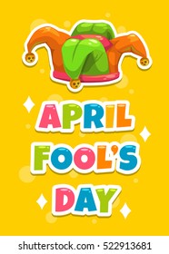 April Fool's day greeting card template. Funny cartoon illustration with Jester's hat and slogan on yellow background. Vector banner with Joker's cap.