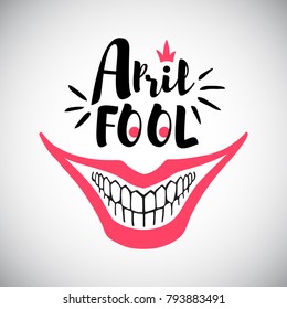 April Fool's Day greeting card. Typographic composition with creepy clown's smile and bared teeth illustration. Joker's grin and 1st April words.