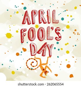 April Fools Day illustration with cartoon monkey on paper background with colorful splash.