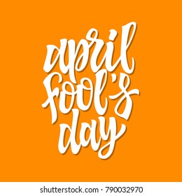 April Fools Day - vector hand drawn brush pen lettering. White text on orange background. High quality calligraphy for greeting card, print, poster, banner