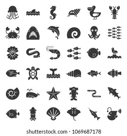 Aquatic Ocean life such as octopus, shell, pelican,herd of fish, solid icon set