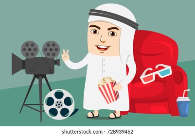 Arab Boy or Man watching movie in a Cinema or Theater. Excited about new released film. Saudi Government has lifted the ban off cinemas in country for entertainment.