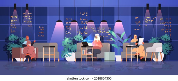 arab businesspeople working in creative open space arabic business people team in night dark office