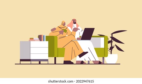 arab couple with credit card using laptop online shopping concept man woman ordering goods together