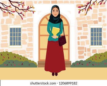 Arab girl with cute face in red skirt and blue blouse with yellow book in hands.Muslim people.