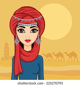 Arab girl in a turban in the desert.