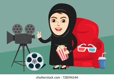 Arab Girl or Woman watching movie in a Cinema or Theater. Excited about new released film. Saudi Government has lifted the ban off cinemas in country for entertainment.