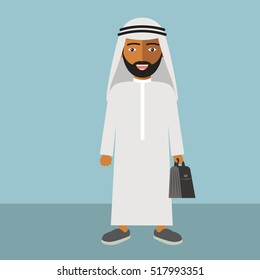 Arab Man in Traditional Dress Standing Holding Black Briefcase for Business.
