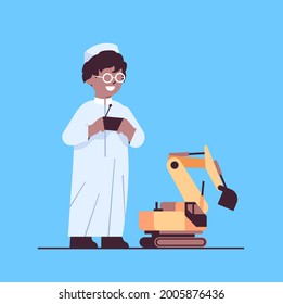 arab schoolboy playing with radio controlled tractor toy smiling boy having fun full length