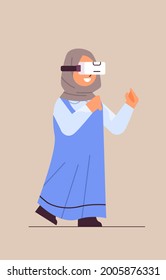 arab schoolgirl wearing vr headset smiling girl in digital glasses exploring virtual reality interactive services