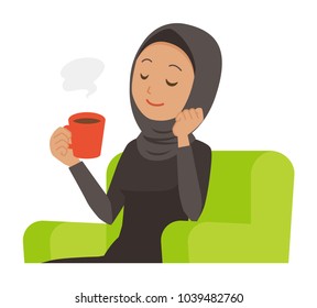 An Arab Woman Wearing Ethnic Costumes Is Sitting On A Sofa And Drinking Coffee