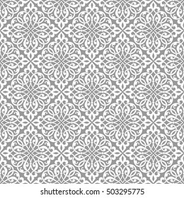 Arabesque. Vintage abstract floral seamless pattern. Intersecting curved elegant stylized leaves and scrolls forming abstract floral ornament in Arabic style.
