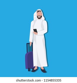 Arabic businessman using smartphone holding valise wearing traditional clothes travel concept male cartoon character avatar blue background full length flat vector illustration