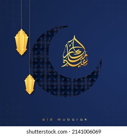 Arabic Calligraphy Of Golden Eid Mubarak With Paper Cut Lanterns Hang And Crescent Moon In Flower Pattern Against Blue Background.