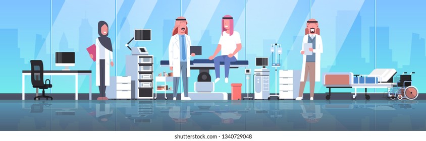 arabic doctors team visiting disabled man patient in hijab sitting on operation table healthcare concept hospital room interior modern equipment medical clinic horizontal full length