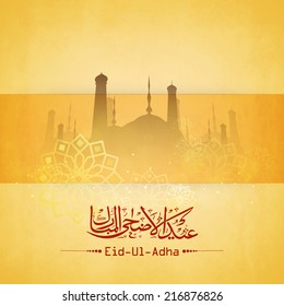 Arabic islamic calligraphy of the text Eid-Ul-Adha with mosque on floral design decorated yellow background. 