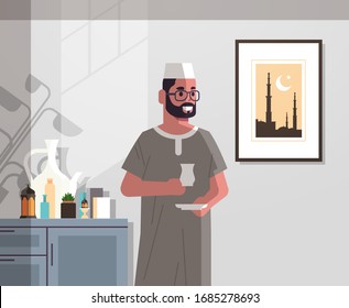 arabic man in traditional clothes drinking coffee celebrating ramadan kareem holy month modern living room interior flat vertical portrait vector illustration