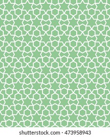 An arabic pattern based on hexagons and circles and diagonal lines.