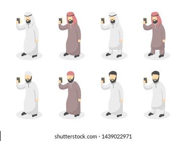 Arabic people hold smartphone. Islamic muslim men using handphone mobile.