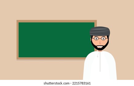 Arabic Teacher from Oman standing in front of the blackboard