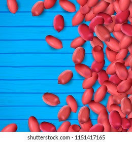 Arachis or peanuts background with red scattered nuts