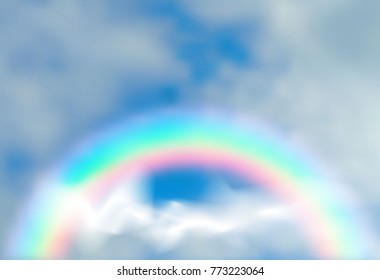 arc of the rainbow through the clouds against the blue sky