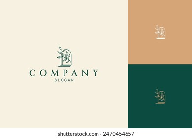 Logotipo bohemio de ventana de arco con plantas estéticas